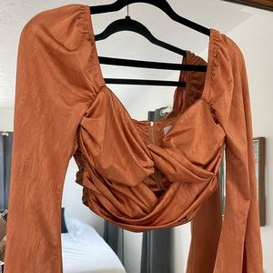 Burnt orange bell sleeve oh Polly top
